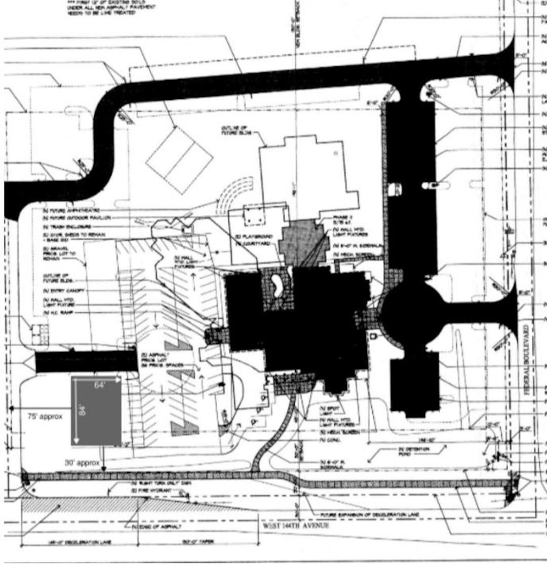 Site plan showing new building to be located at southwest corner of site west of parking lot 