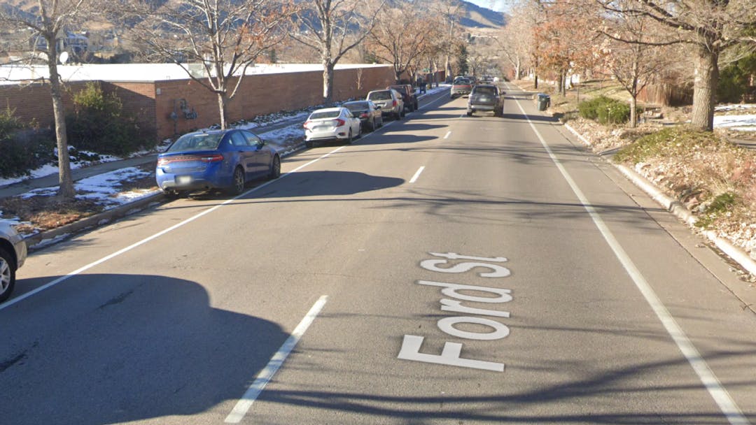 Ford Street with cars parked along the side of the road.