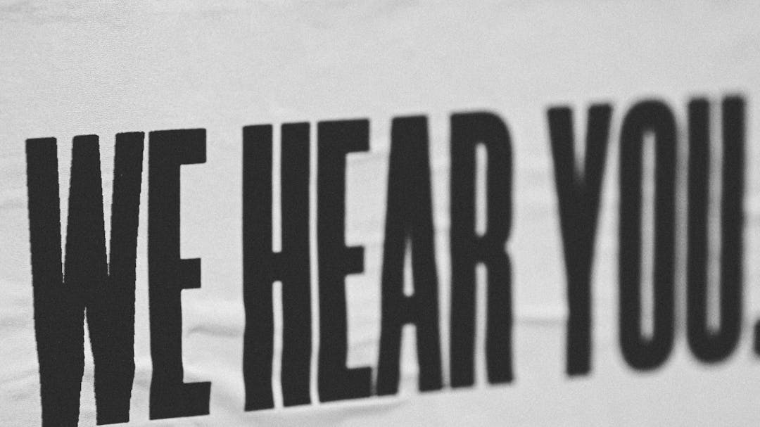 Black text saying "We hear you" in all caps on a white background.