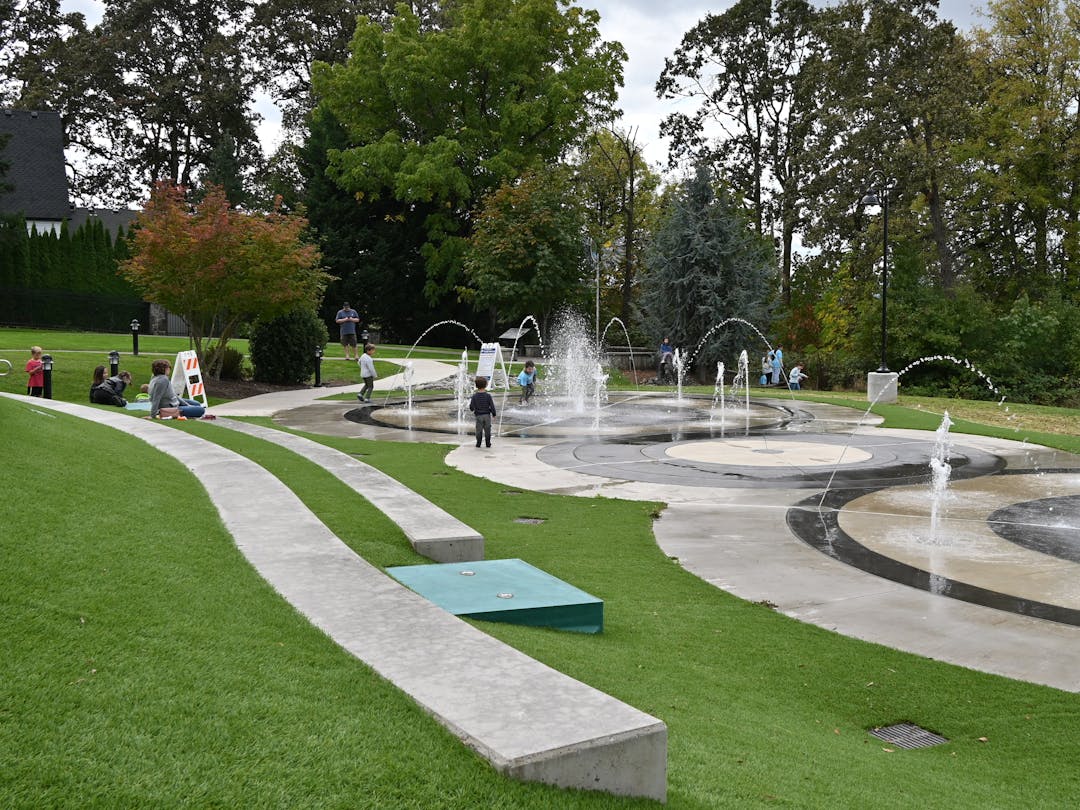 Kids playing in the splash pad.