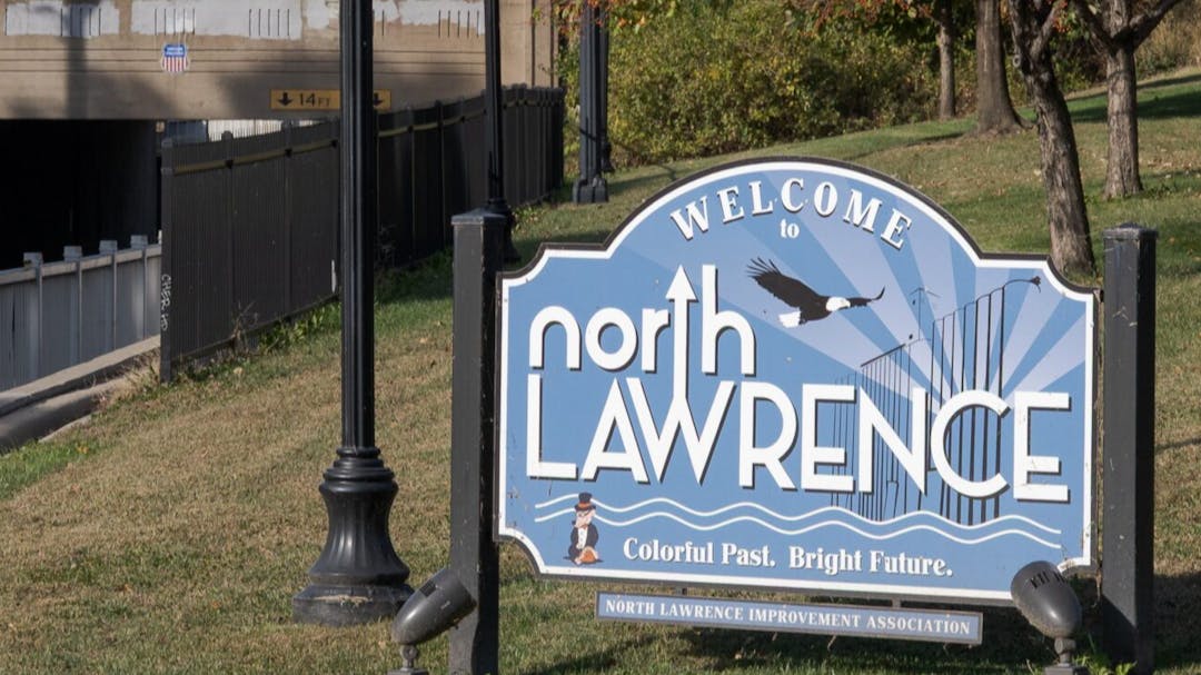 A photo of a sign that says "Welcome to North Lawrence."