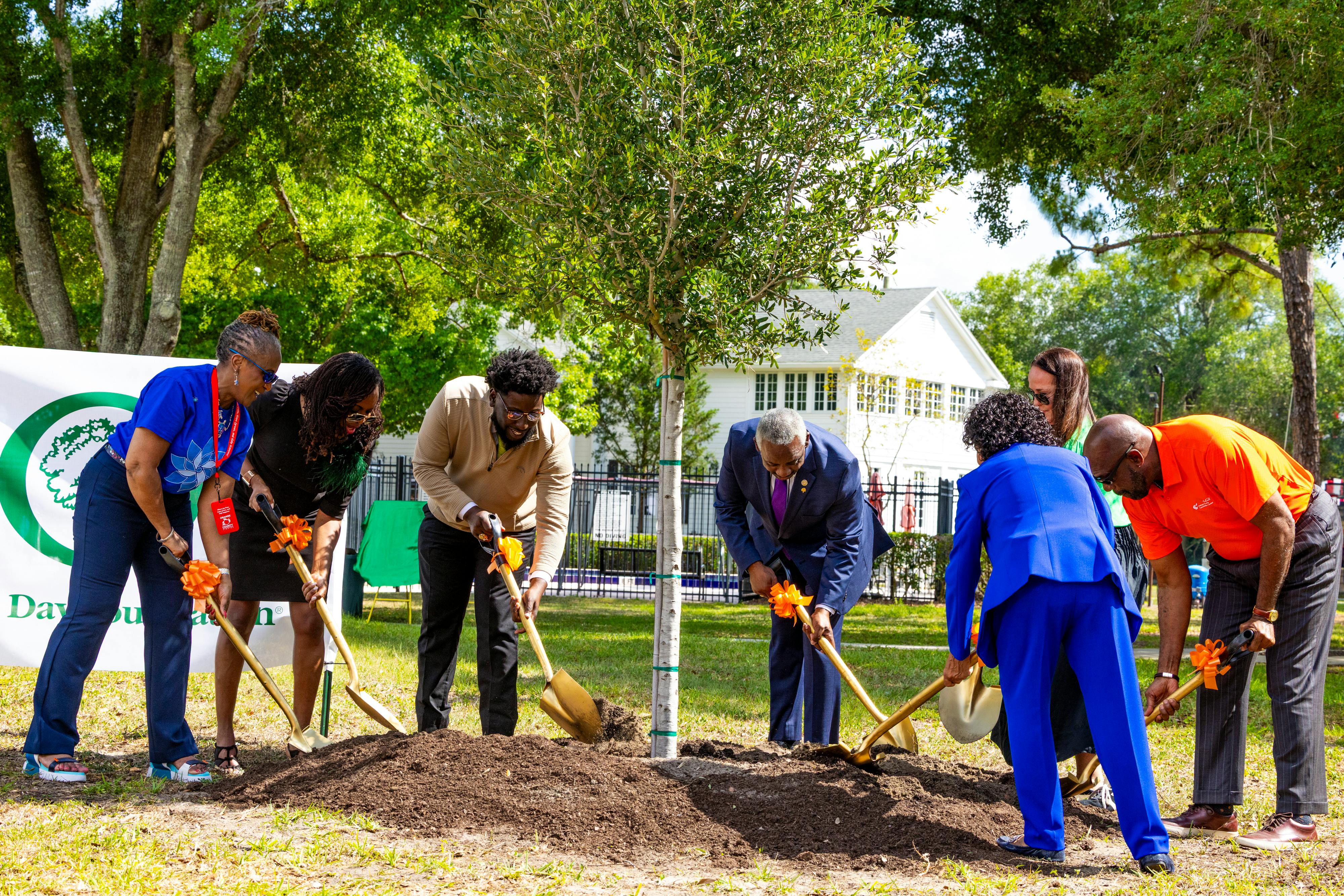 County leaders plant first tree for OC Loves Trees program.