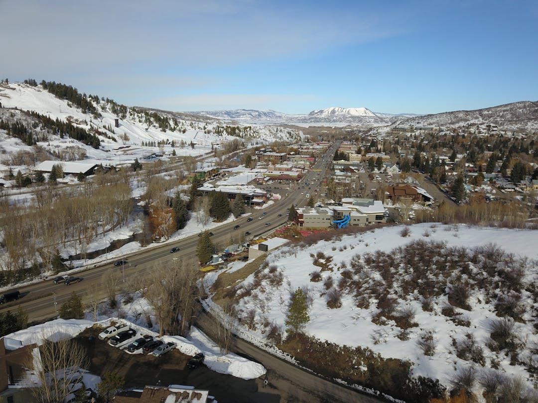 Aerial view of downtown Steamboat Springs and US40/Lincoln Avenue running through it. 