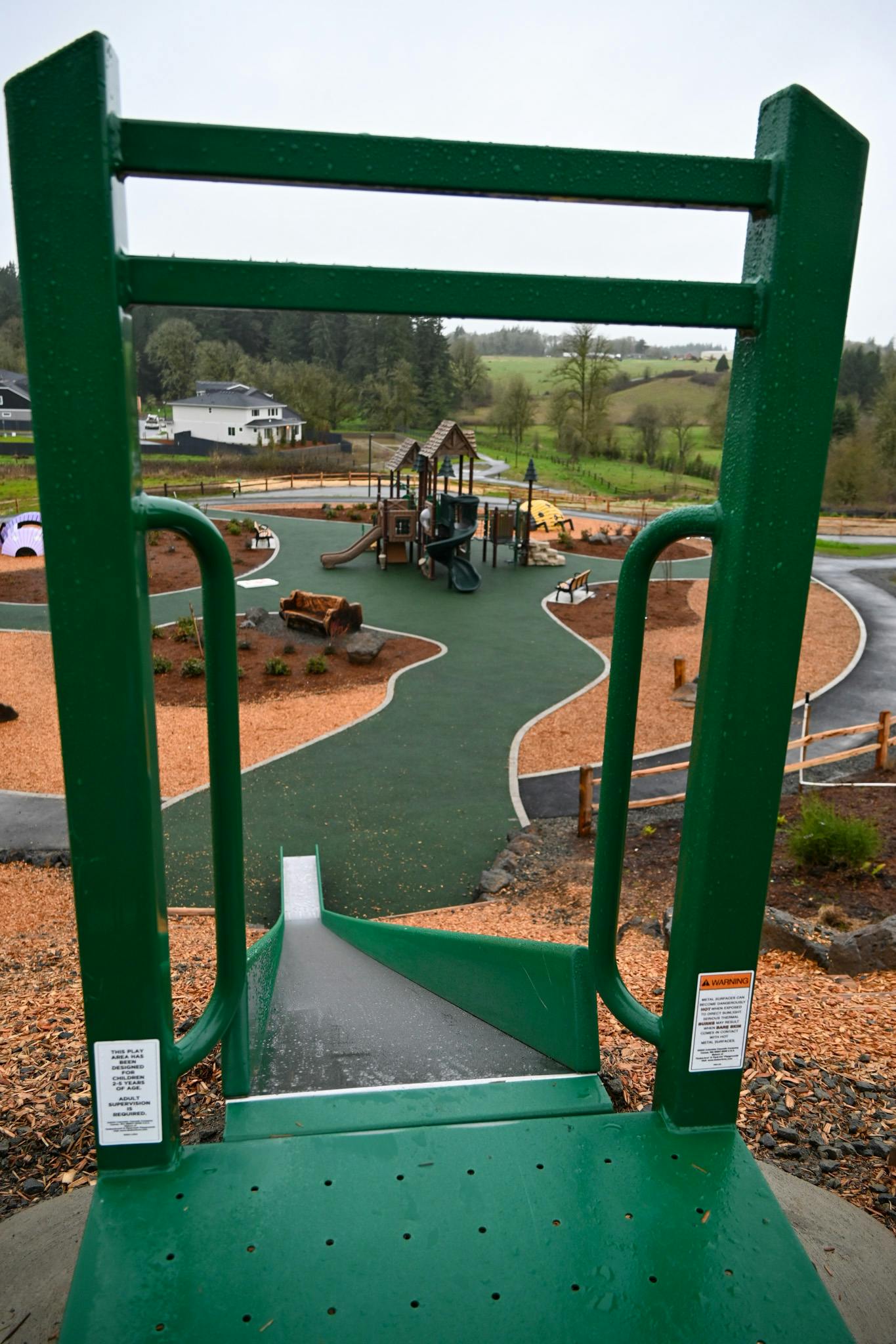 Looking down the slide into the main play area at Storybook Hollow Park. 