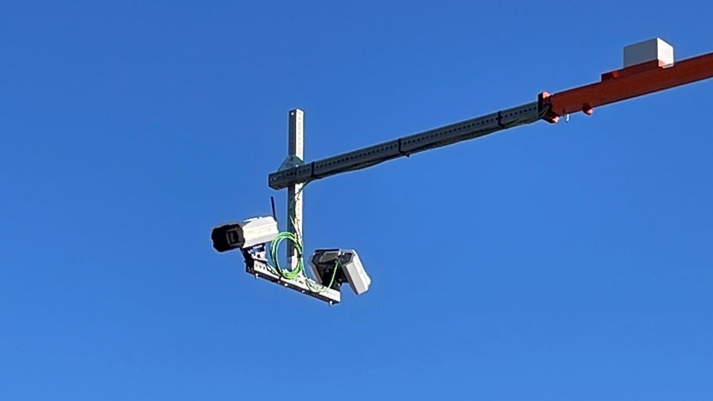 Two cameras will be mounted onto poles that extend over the roadway.