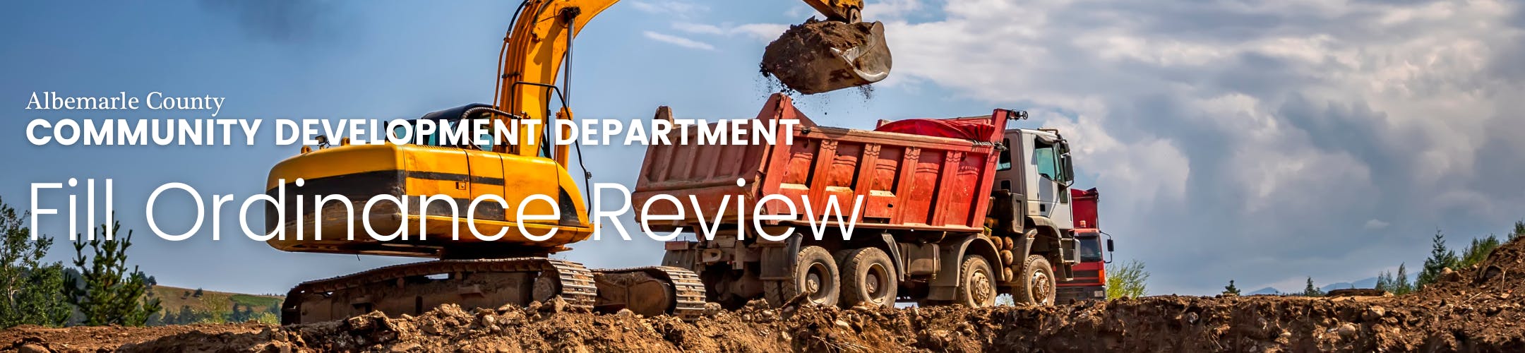 Banner with a dump truck receiving dirt