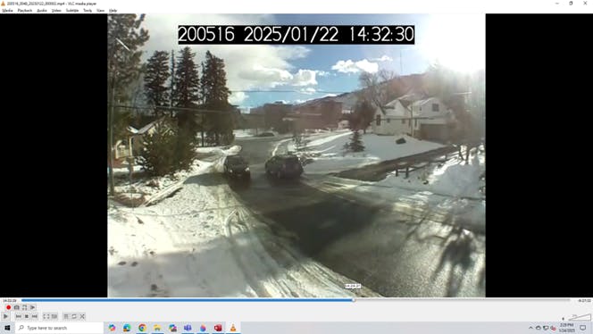 Two SUVs pass with room to spare in the narrowest part of the Pinal road following sidewalk construction.