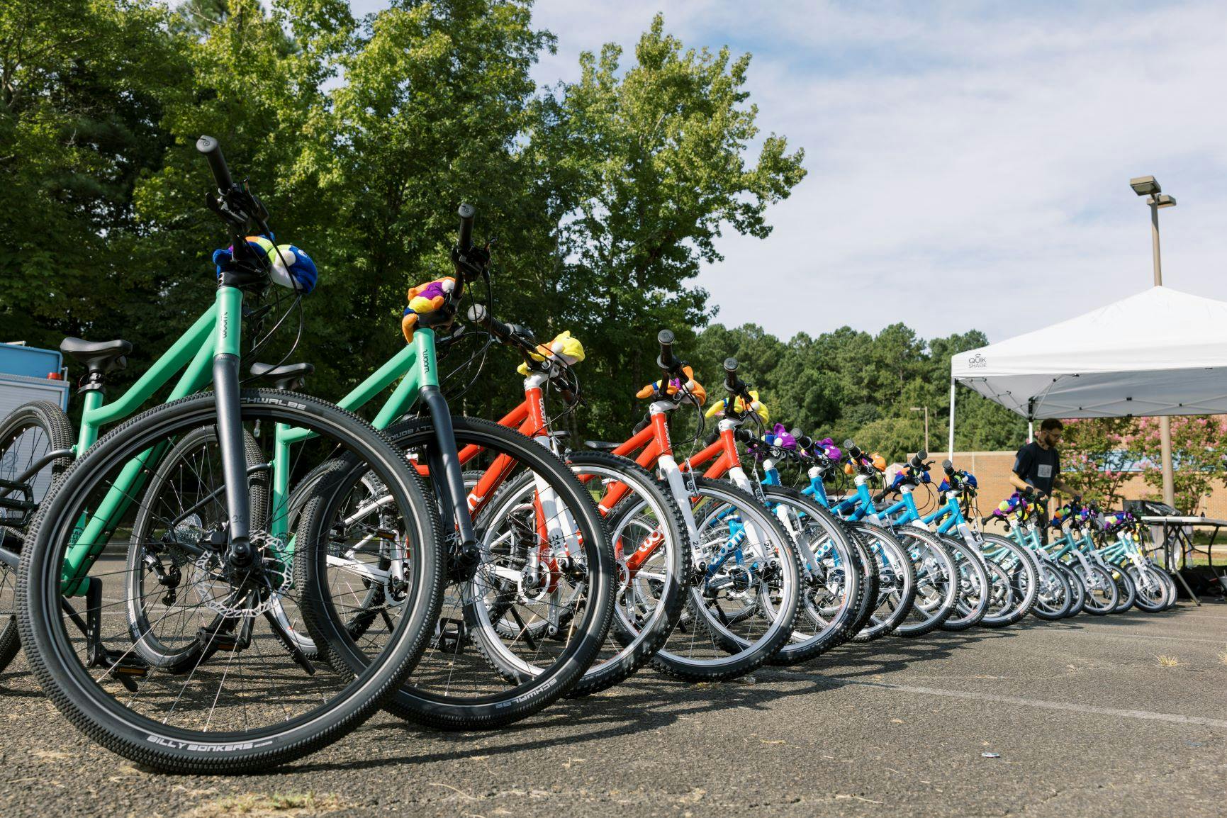 A fleet of kids bikes in a line