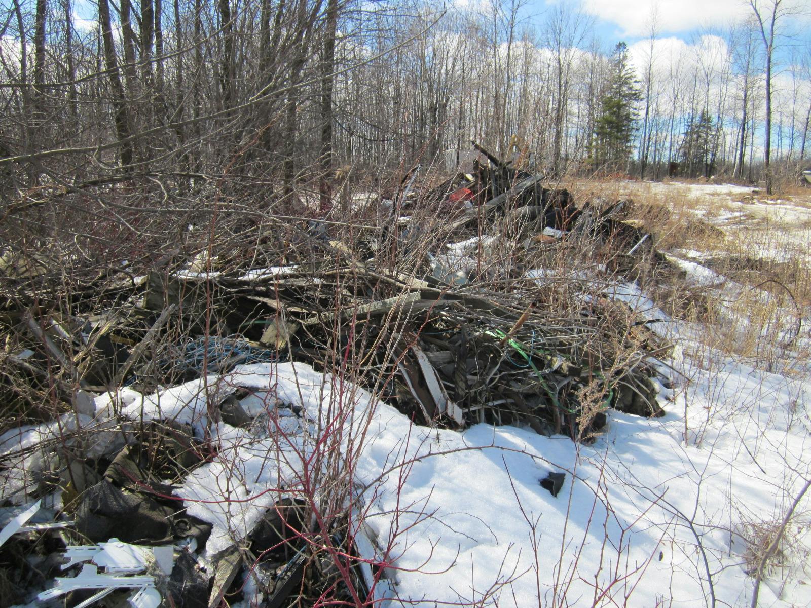 debris pile  on left as you walk up drive way.jpg