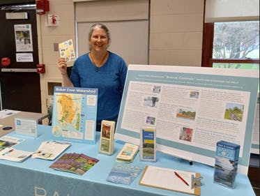 Earth day Expo Maura at table.png