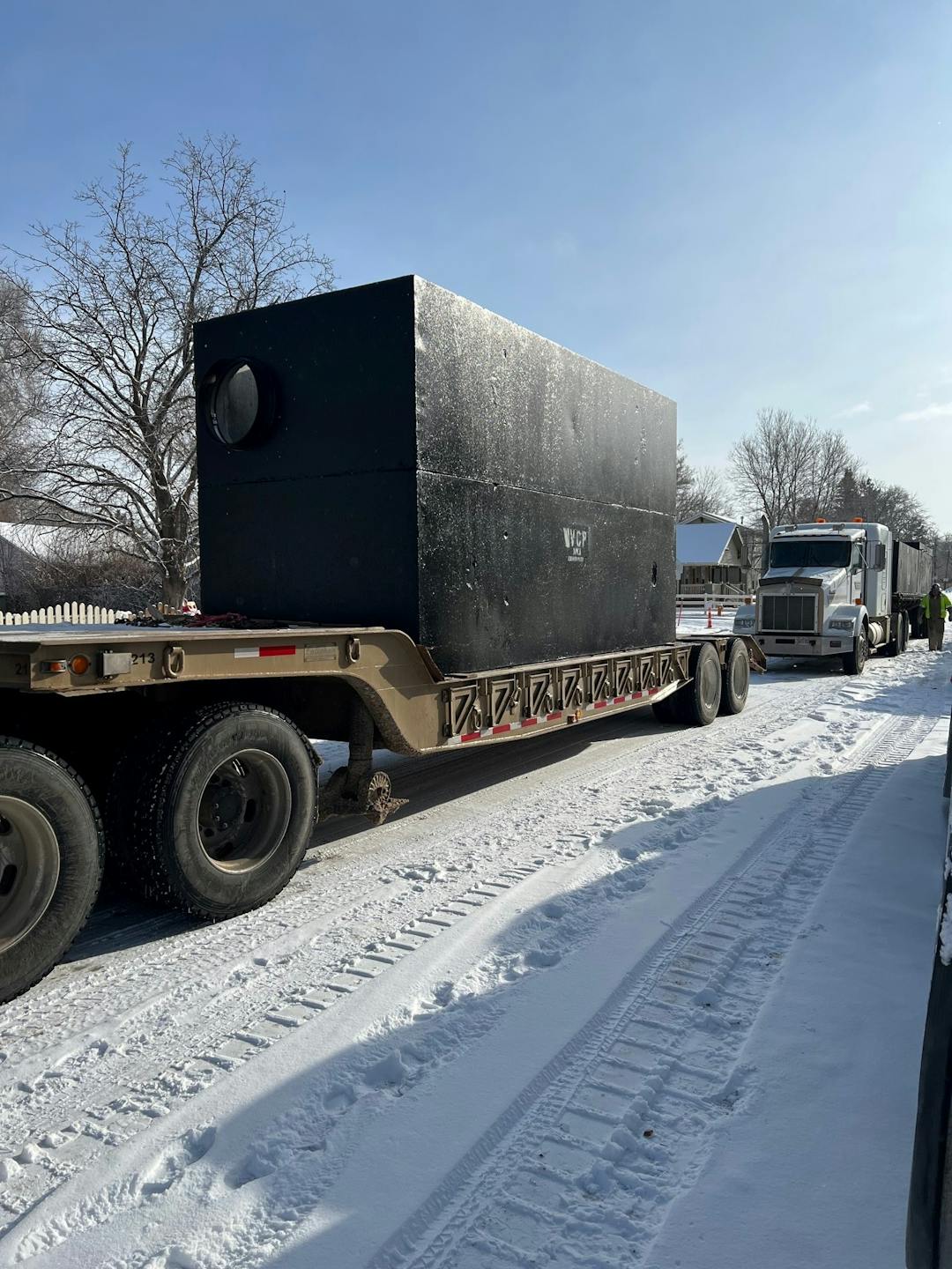 The underground water quality structure was delivered by two trucks, combined, it weighs close to 47,000 lbs and is 17ft long