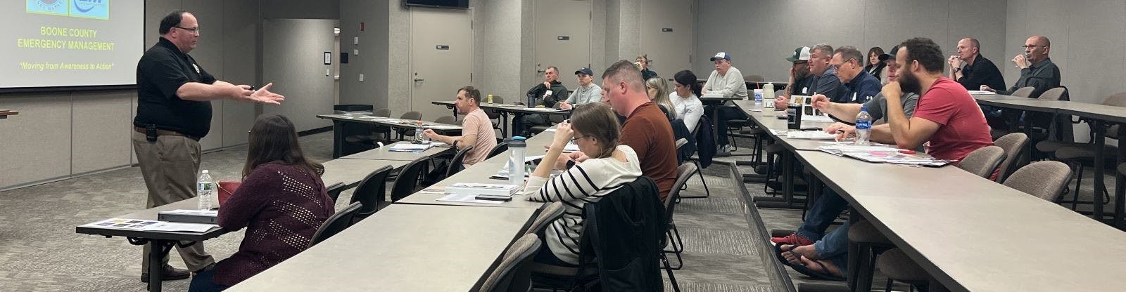 Mark Ihrig, Boone County Emergency Management Services Director, meets with the 2023 Engage class to discuss EMA services