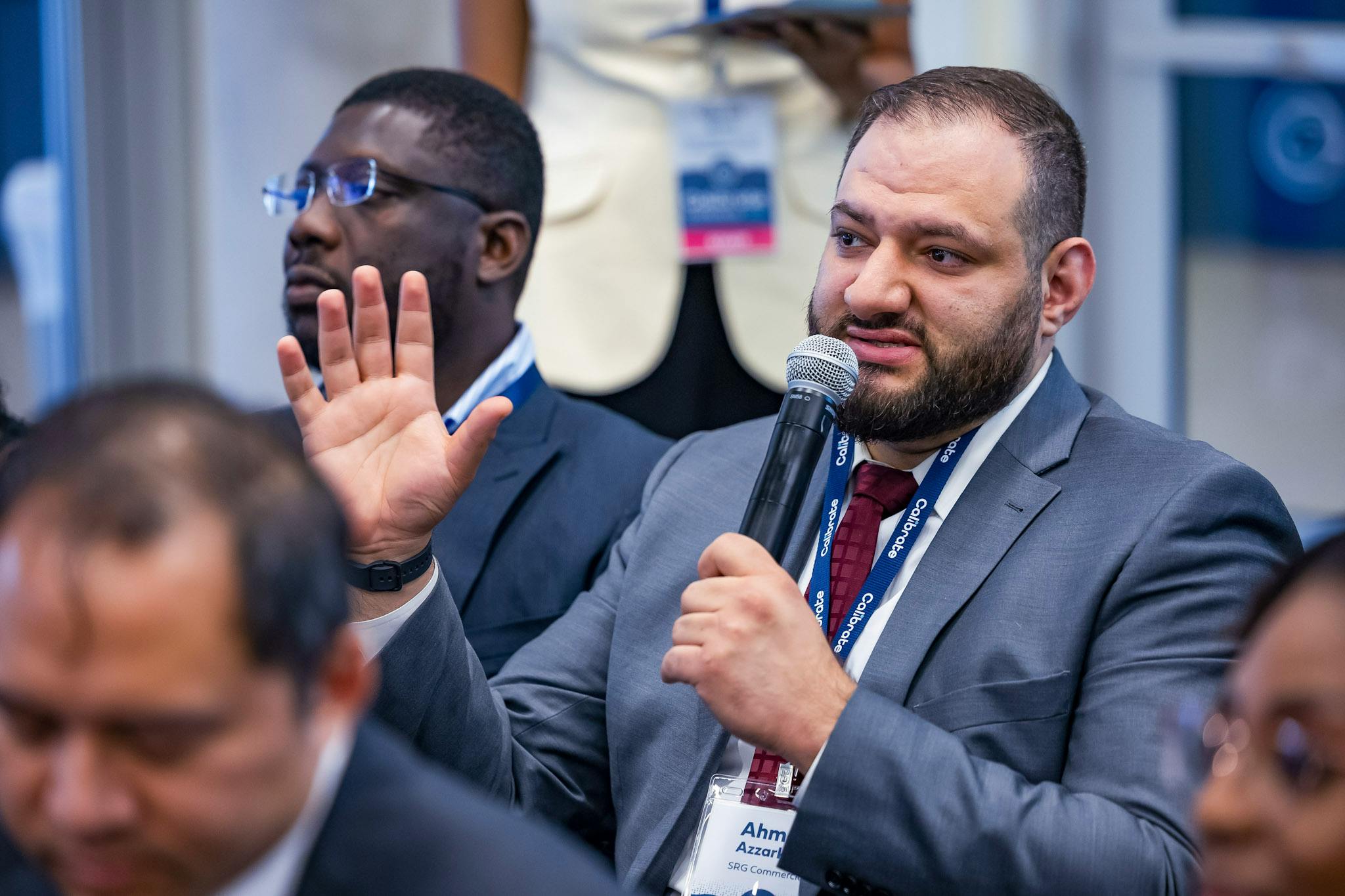 Attendee at the 2026 Calibrate Conference with microphone speaking