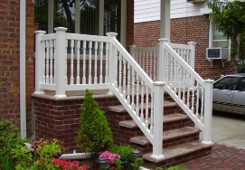 Railing or low wall enclosing porch or stoop
