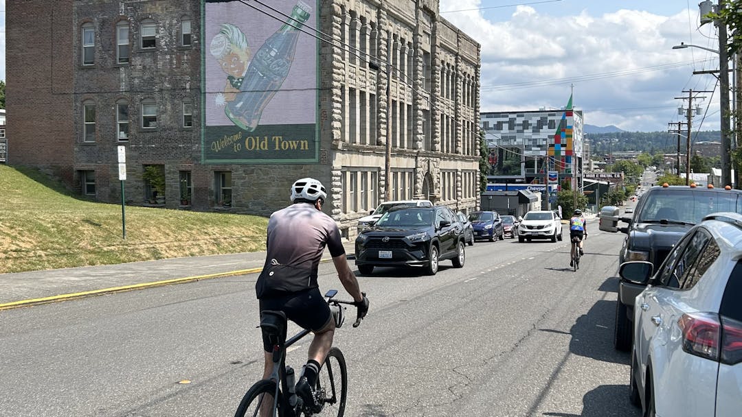 Cyclist riding in Holly Street Bike Lanes entering downtown Bellingham