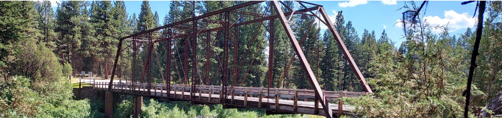 View of Sunset Hill Road Bridge on summer day with trees surrounding it