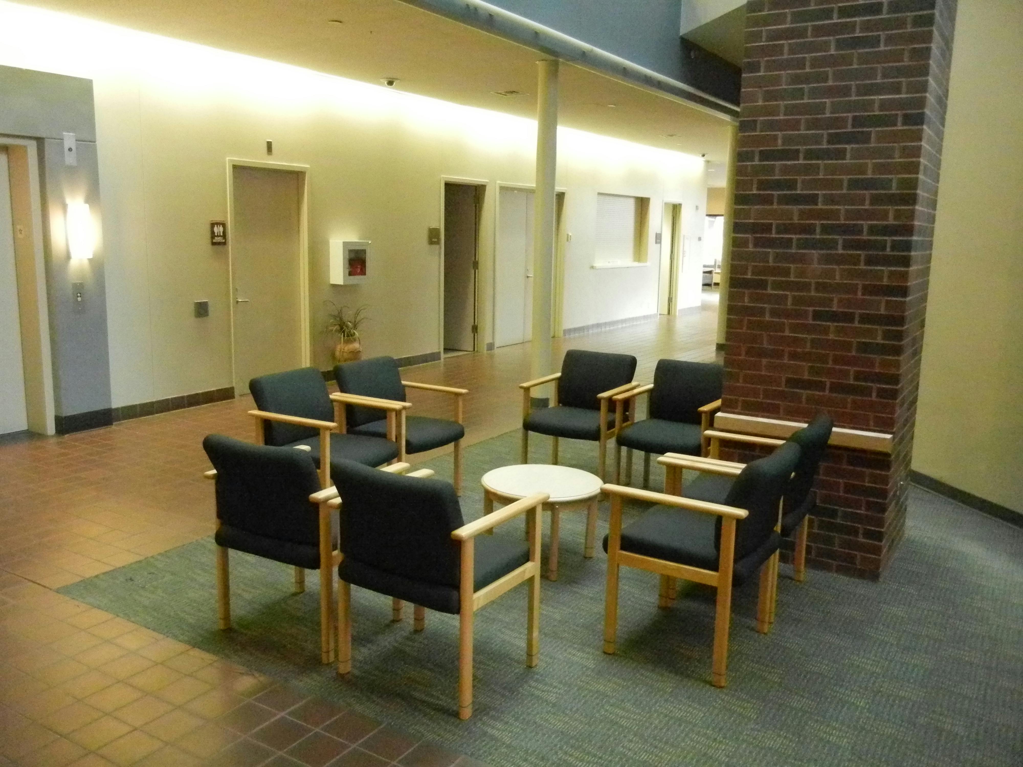The lobby of a community center with chairs.