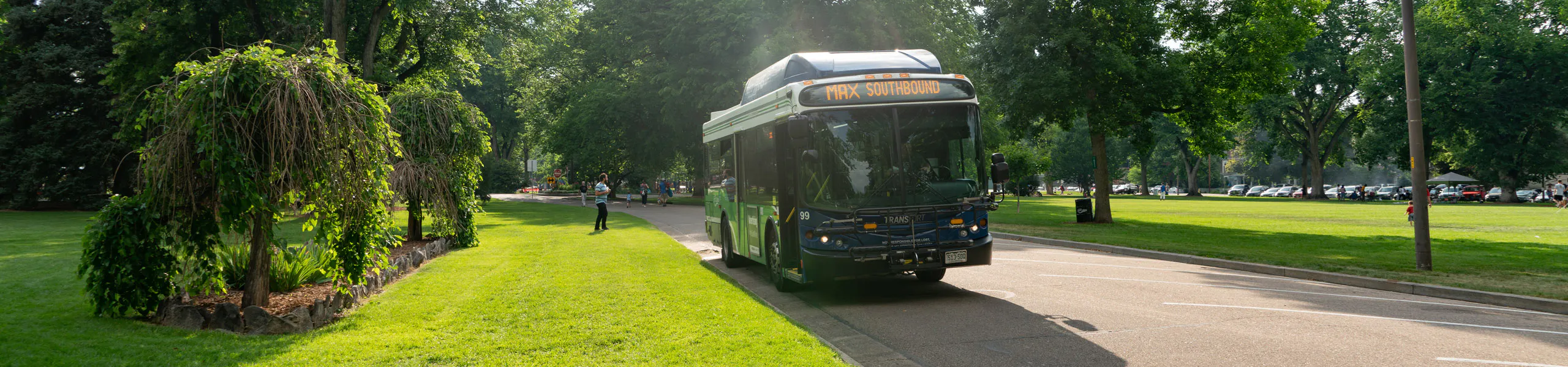 A Transfort bus travels down Plum Street west of the CSU campus