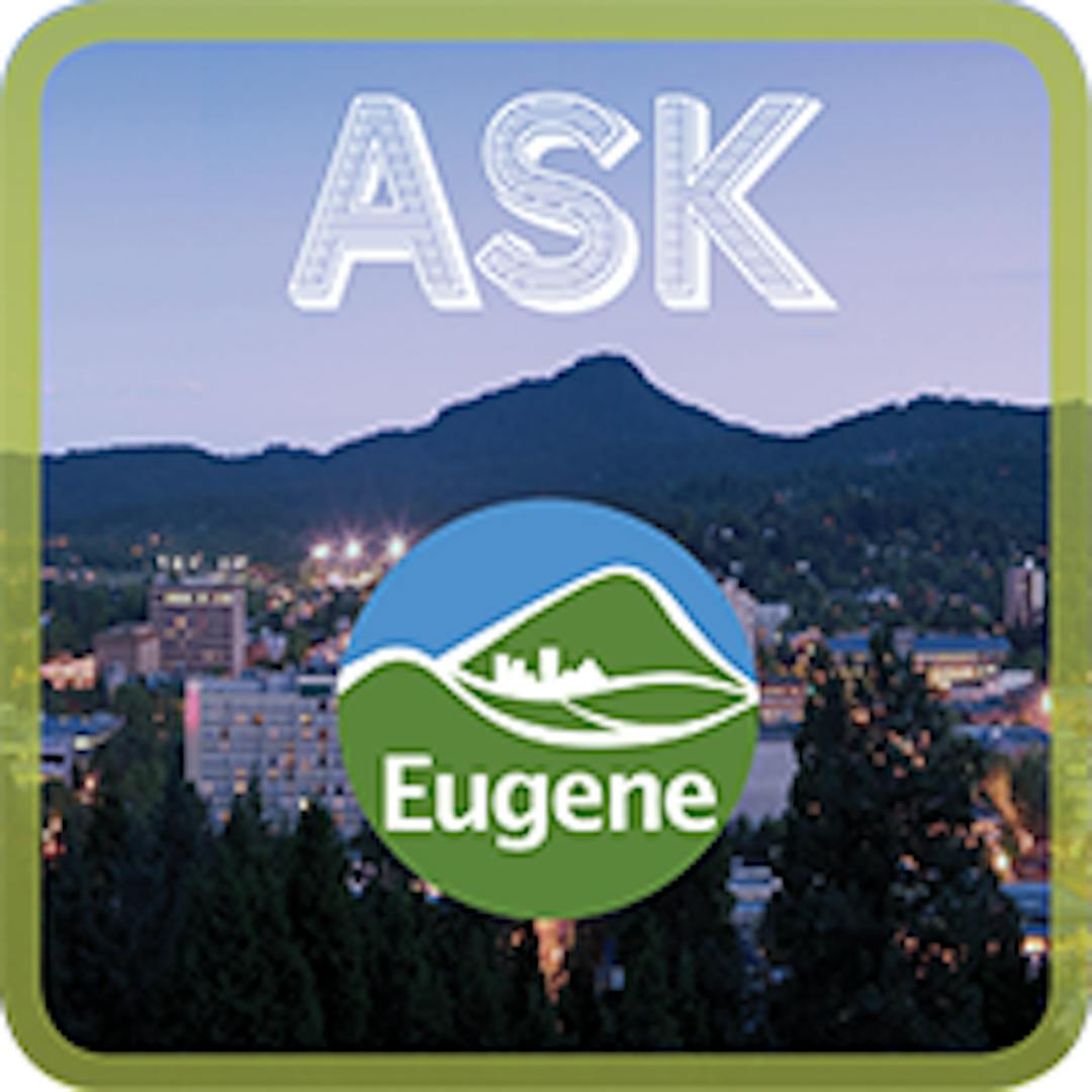 Panoramic view of the City of Eugene at night with City logo.