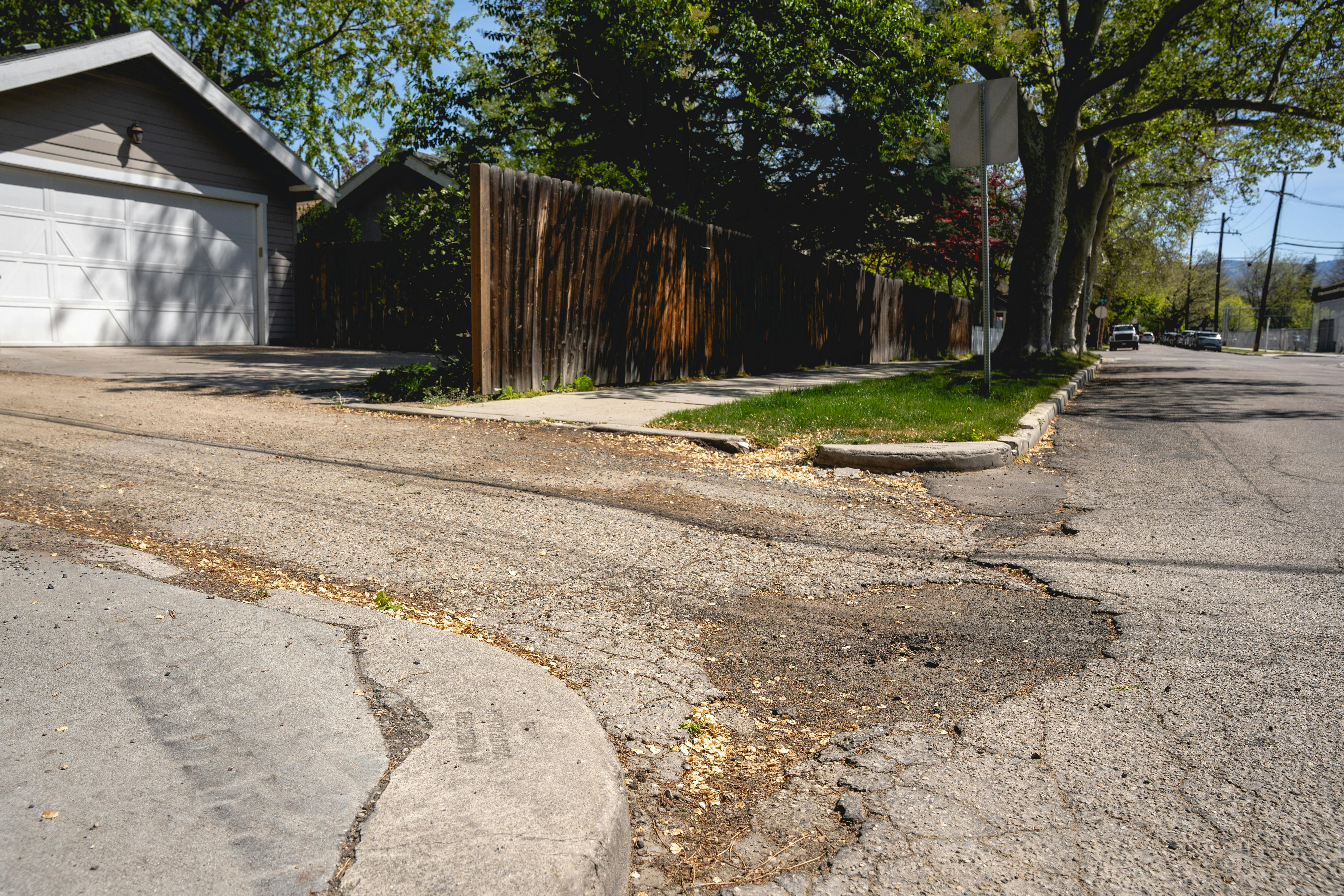 Pothole and cracks in pavement