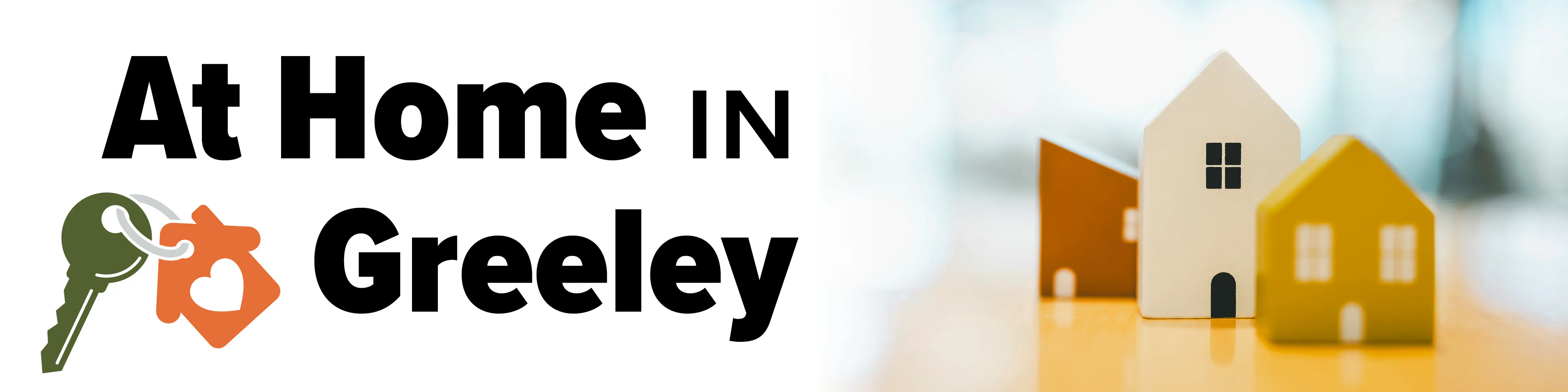 Actual text reads, "At Home in Greeley" accompanied by an image of small play homes and a key on a keychain