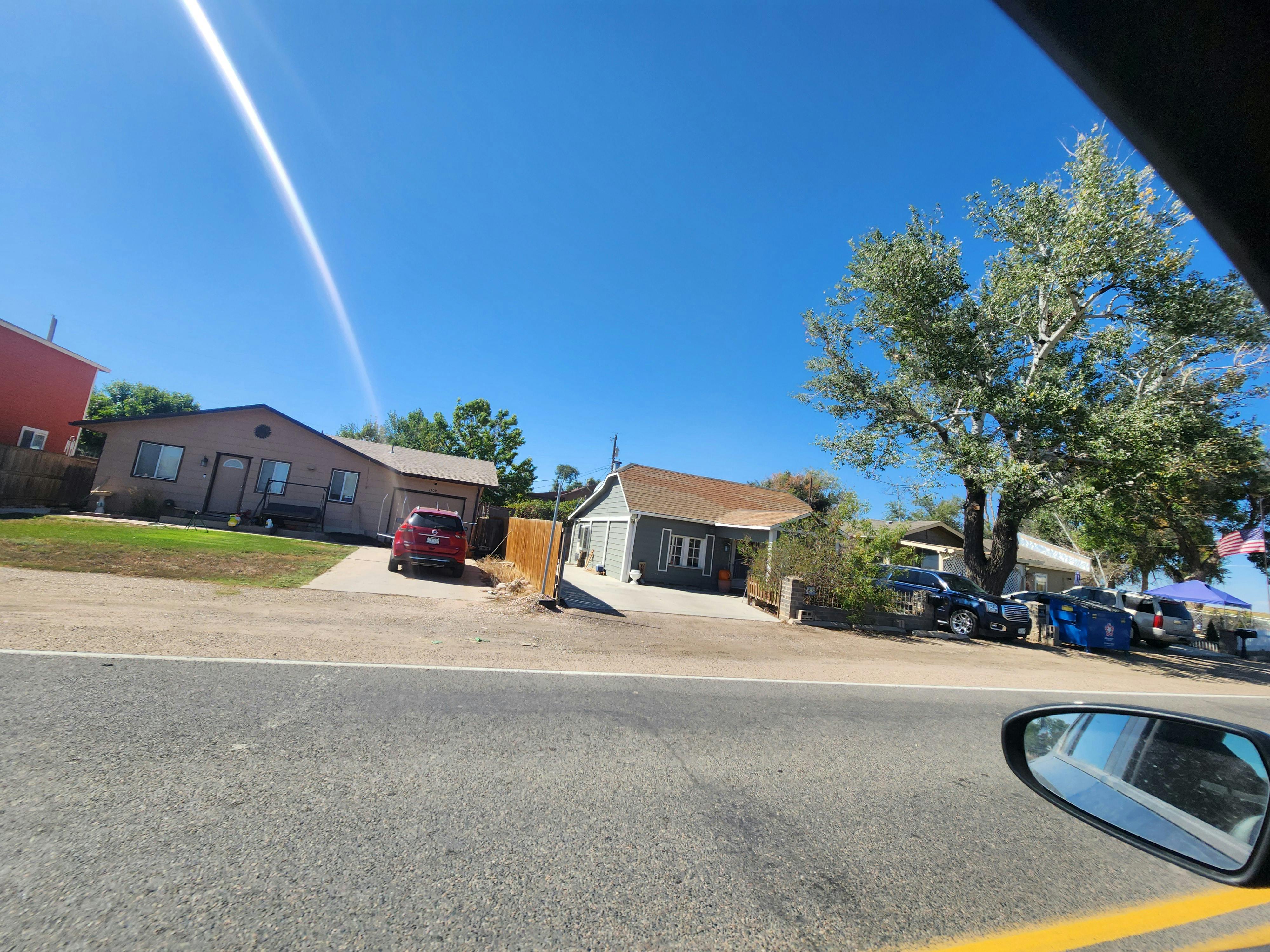 Spanish Colony homes along road.