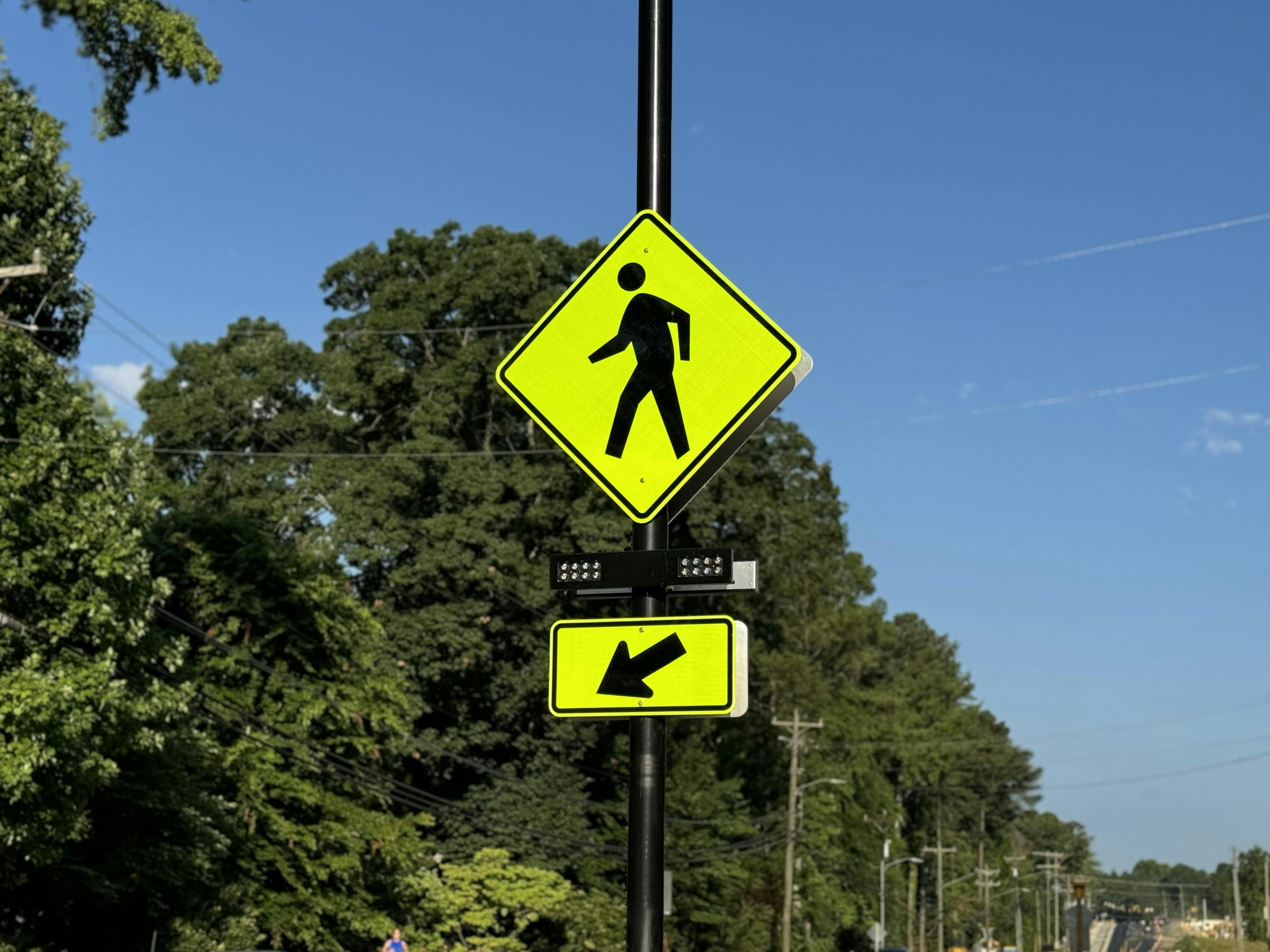 Pedestrian crossing sign and signal