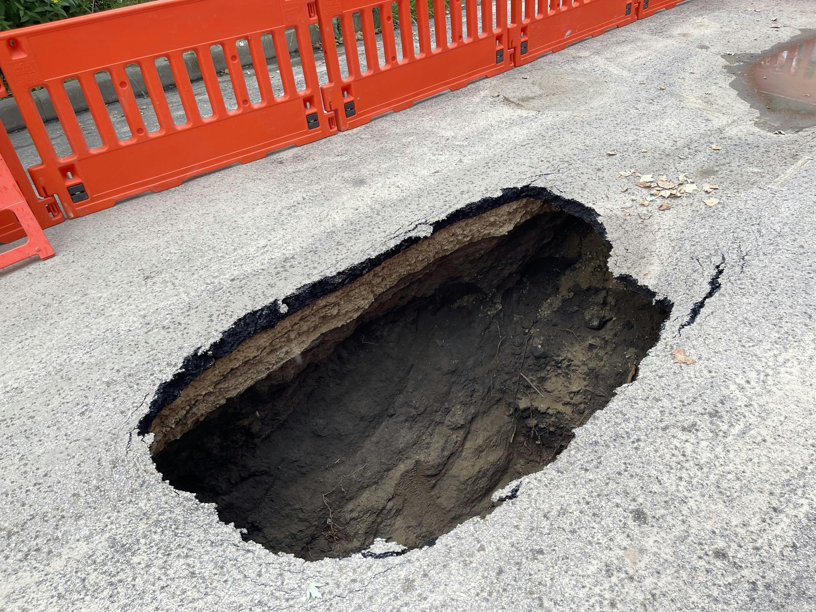 Sink hole shown with barricades on August 24