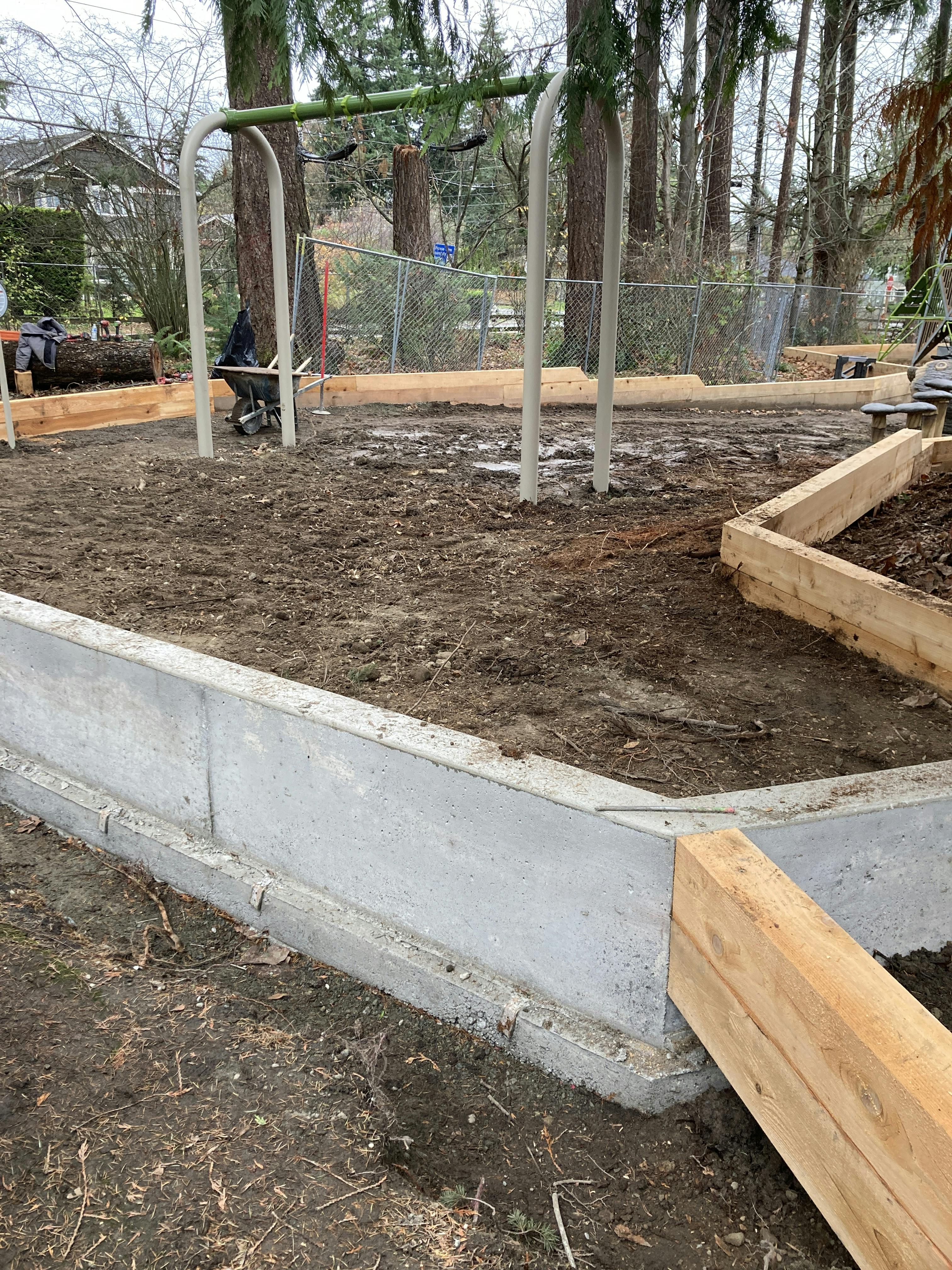 Timber border and concrete curb tie-in