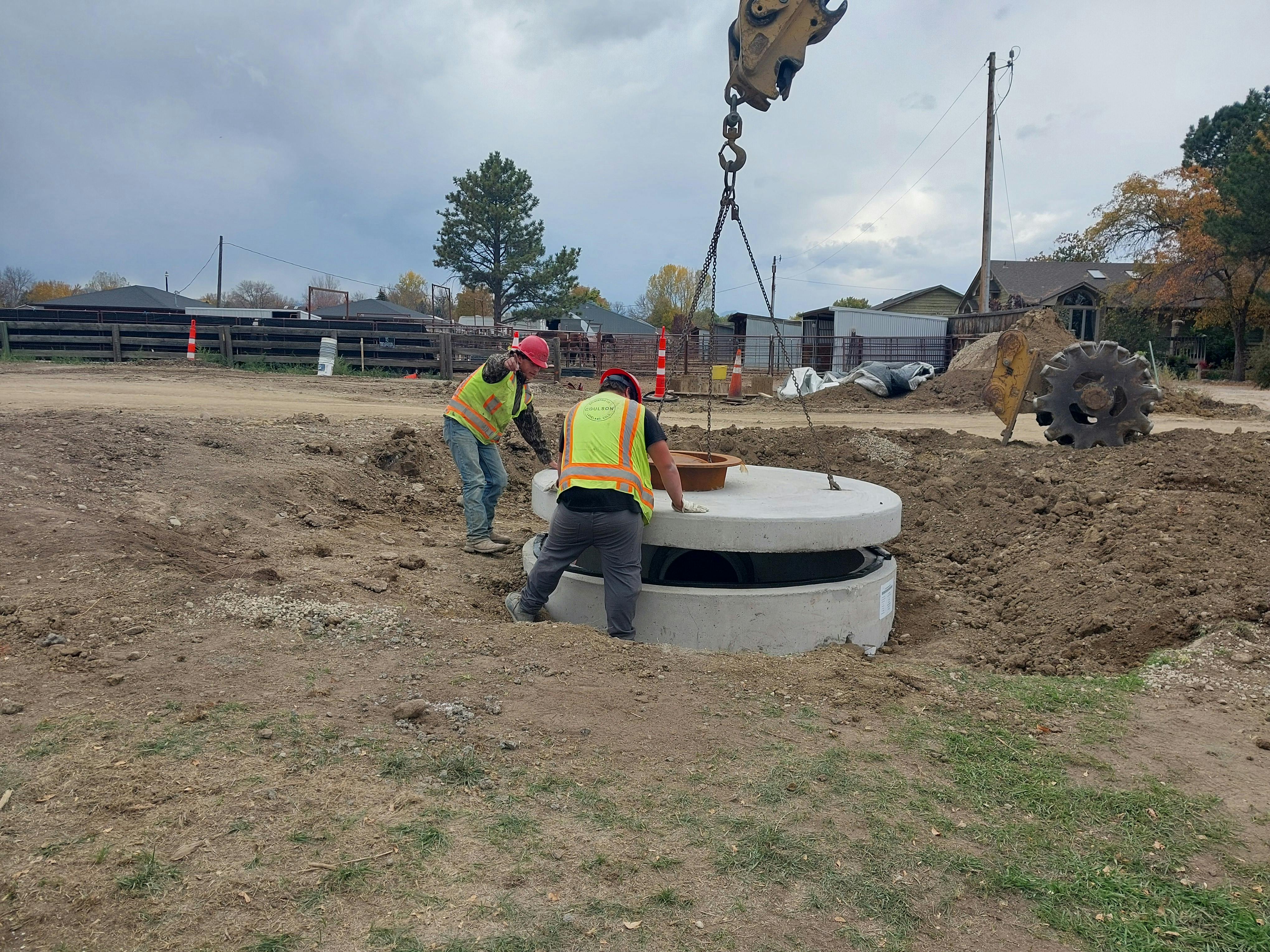 Stormwater manhole lid placement