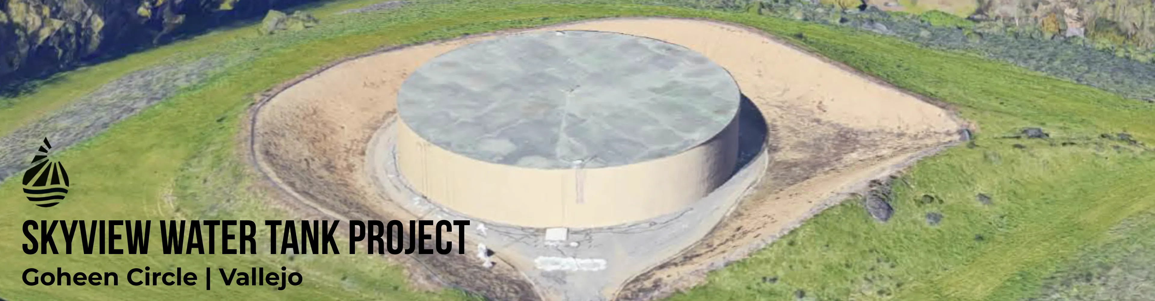 Arial view of Skyview Tank, an enclosed water tank, with surrounding green grass