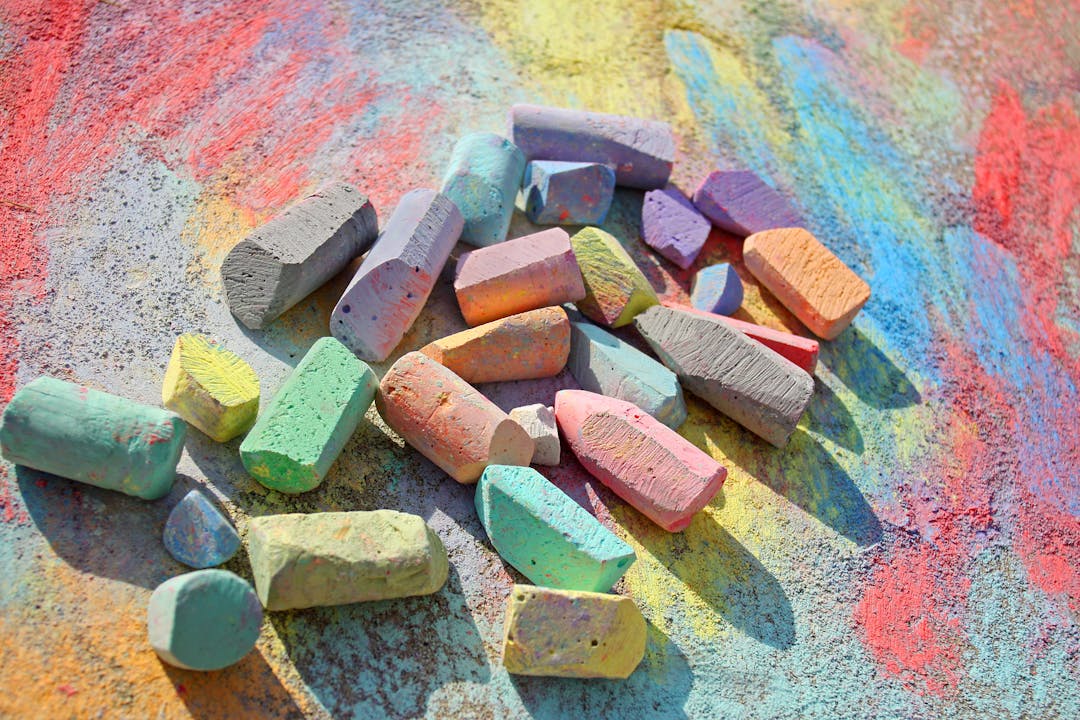 Colorful chalk on a sidewalk.