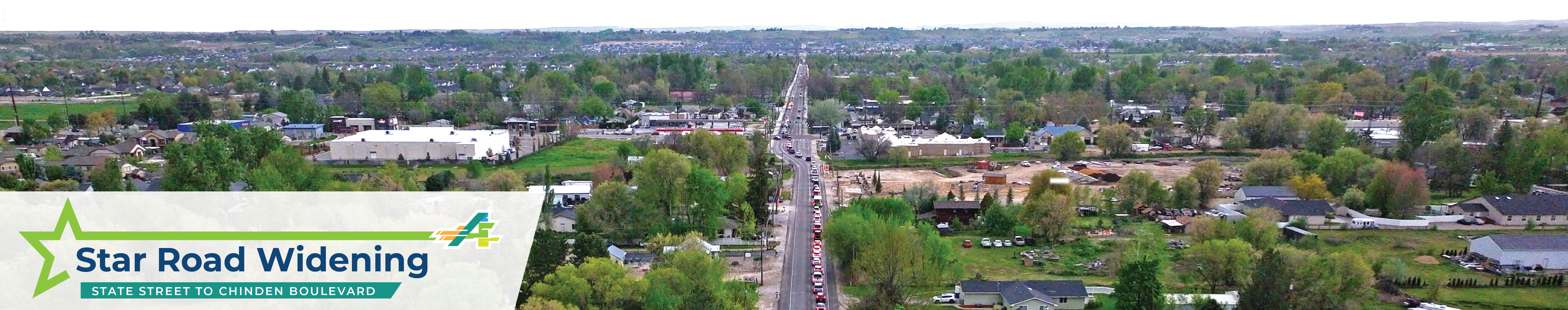 Aerial view of Star Road, a two-lane roadway without bicycle or pedestrian facilities, with traffic backed up