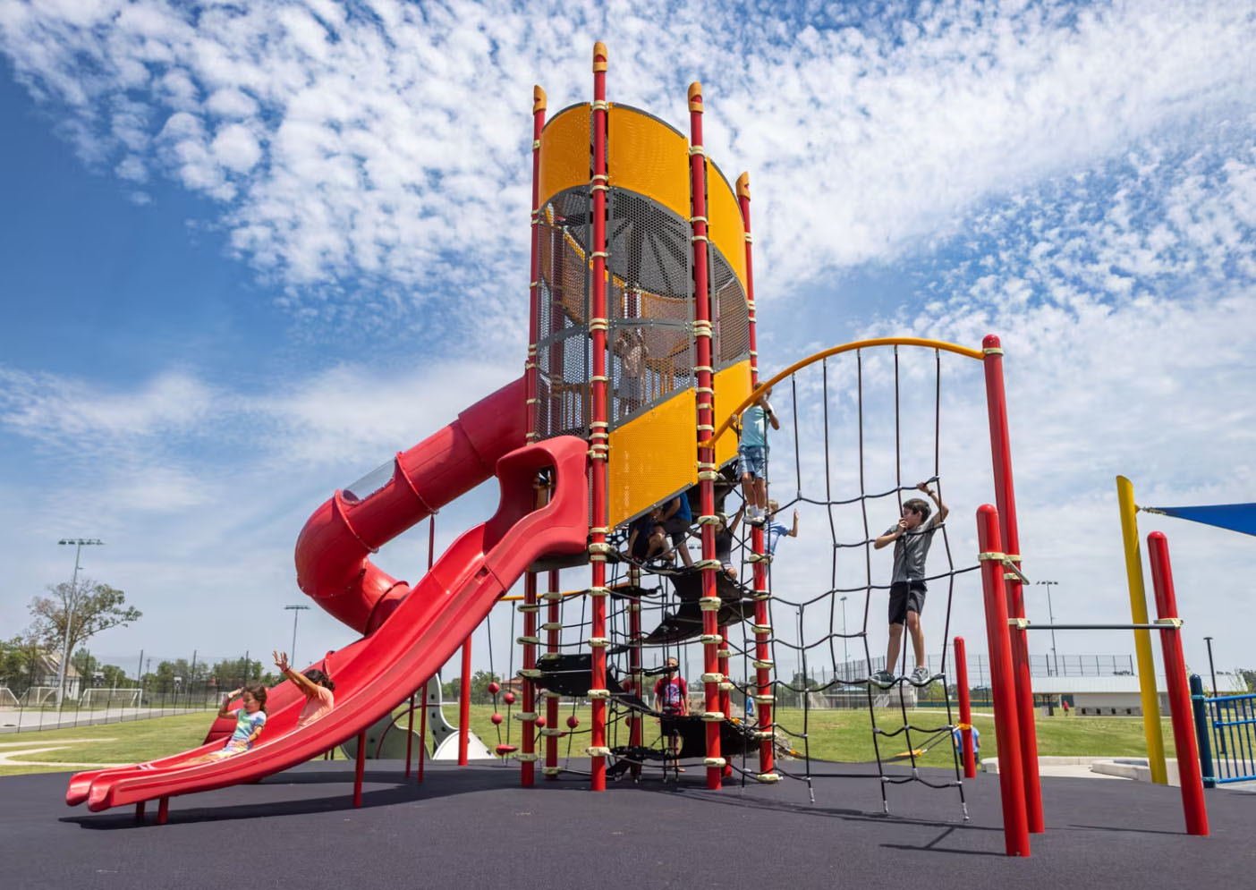 A tall yellow and red playground structure