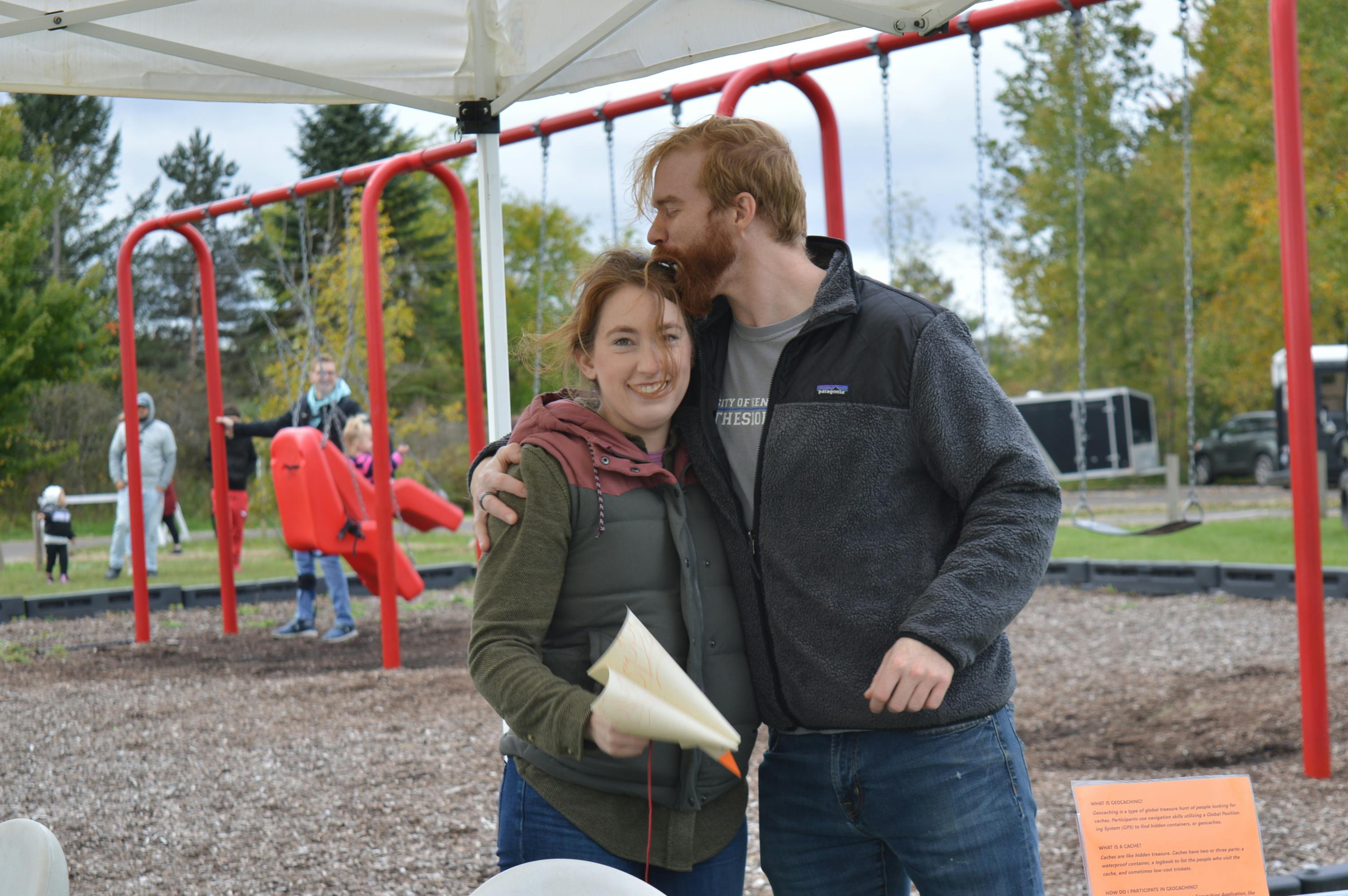 Harvest Festival volunteer gets a hug for a job well done!