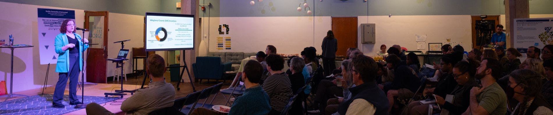 Director of Sustainability addresses the attendees of the Climate Action Plan public meetings