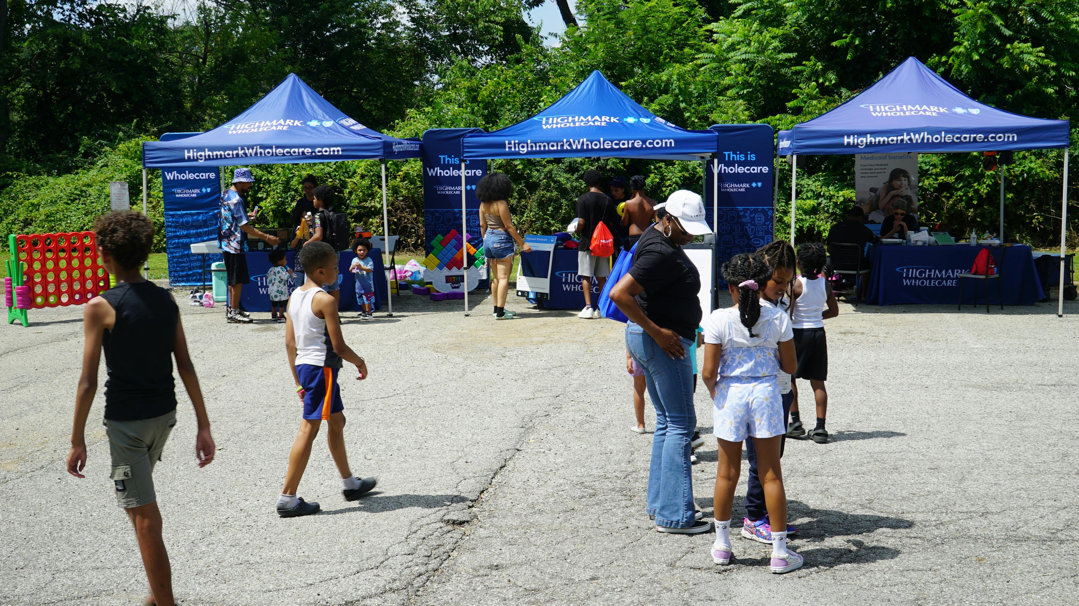 Highmark Wholecare, one of HACP's many community partners, is set up at an Arlington Heights Community Day event.
