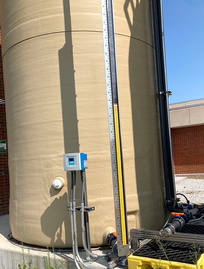 Yellow lines on the gauge give staff an idea of how much liquid ammonium sulfide remains in the tank.