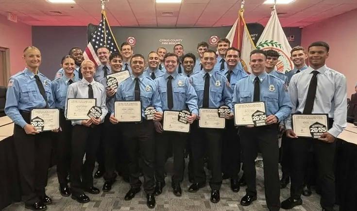 fire academy graduates holding their certificates